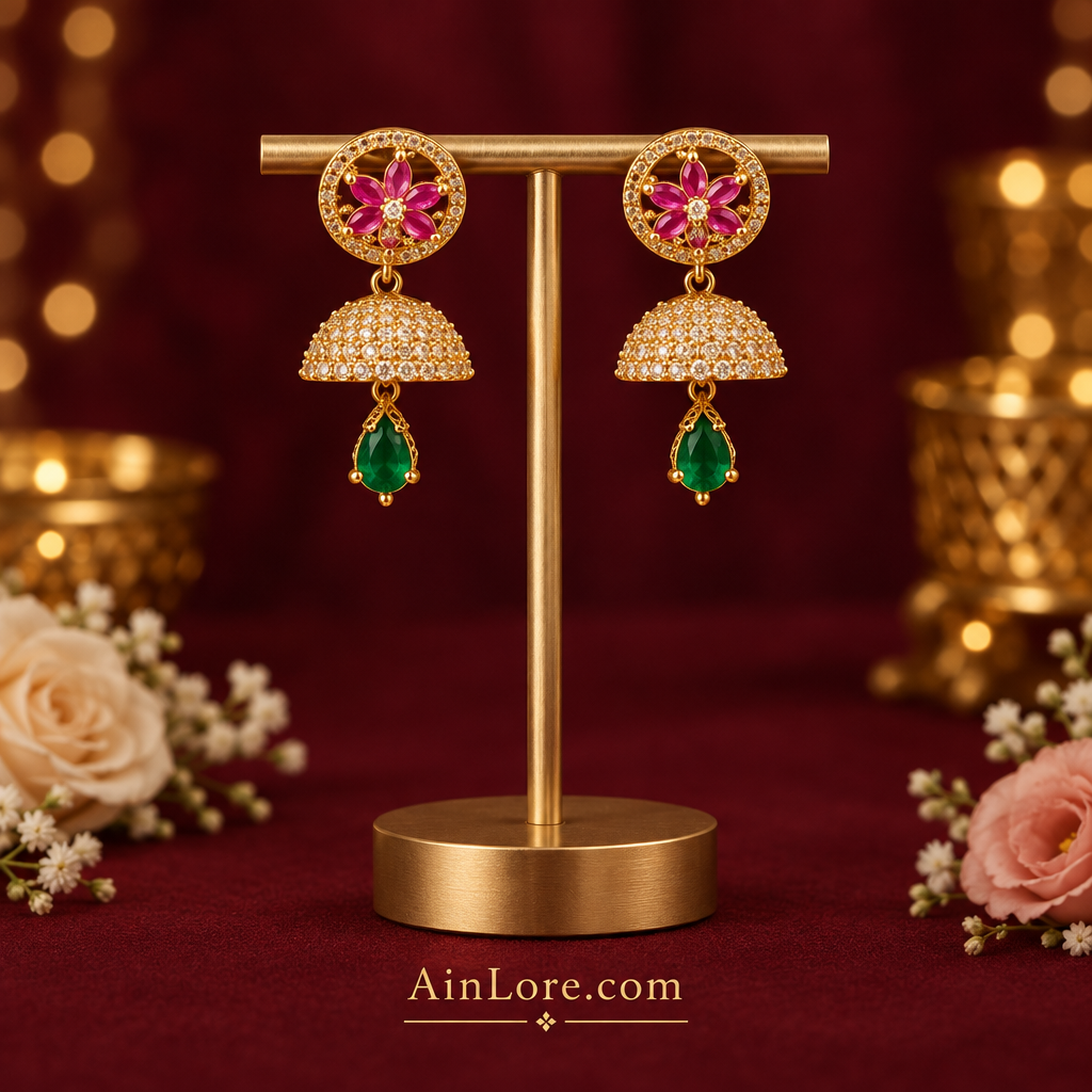 Pink and green jhumkas on a T-stand