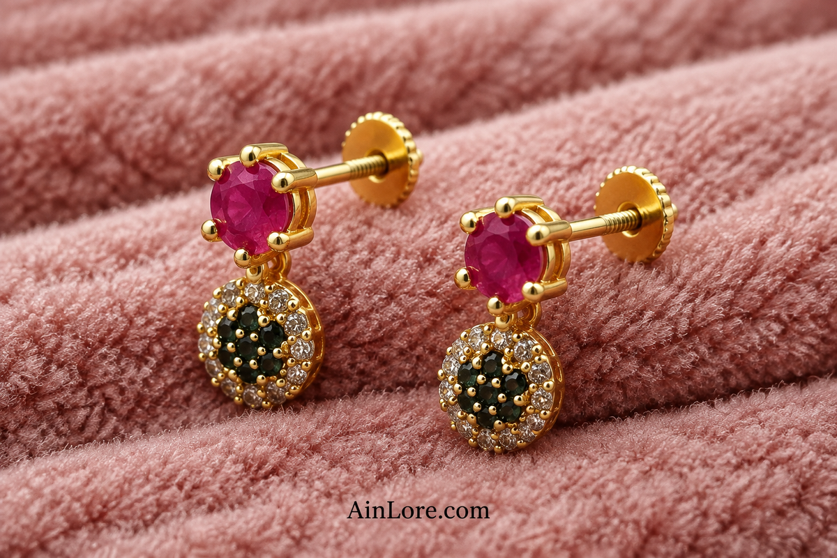 Tilted pink-and-dark-stone earrings showing screw closures