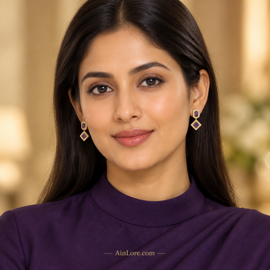 Ananya wearing purple geometric earrings