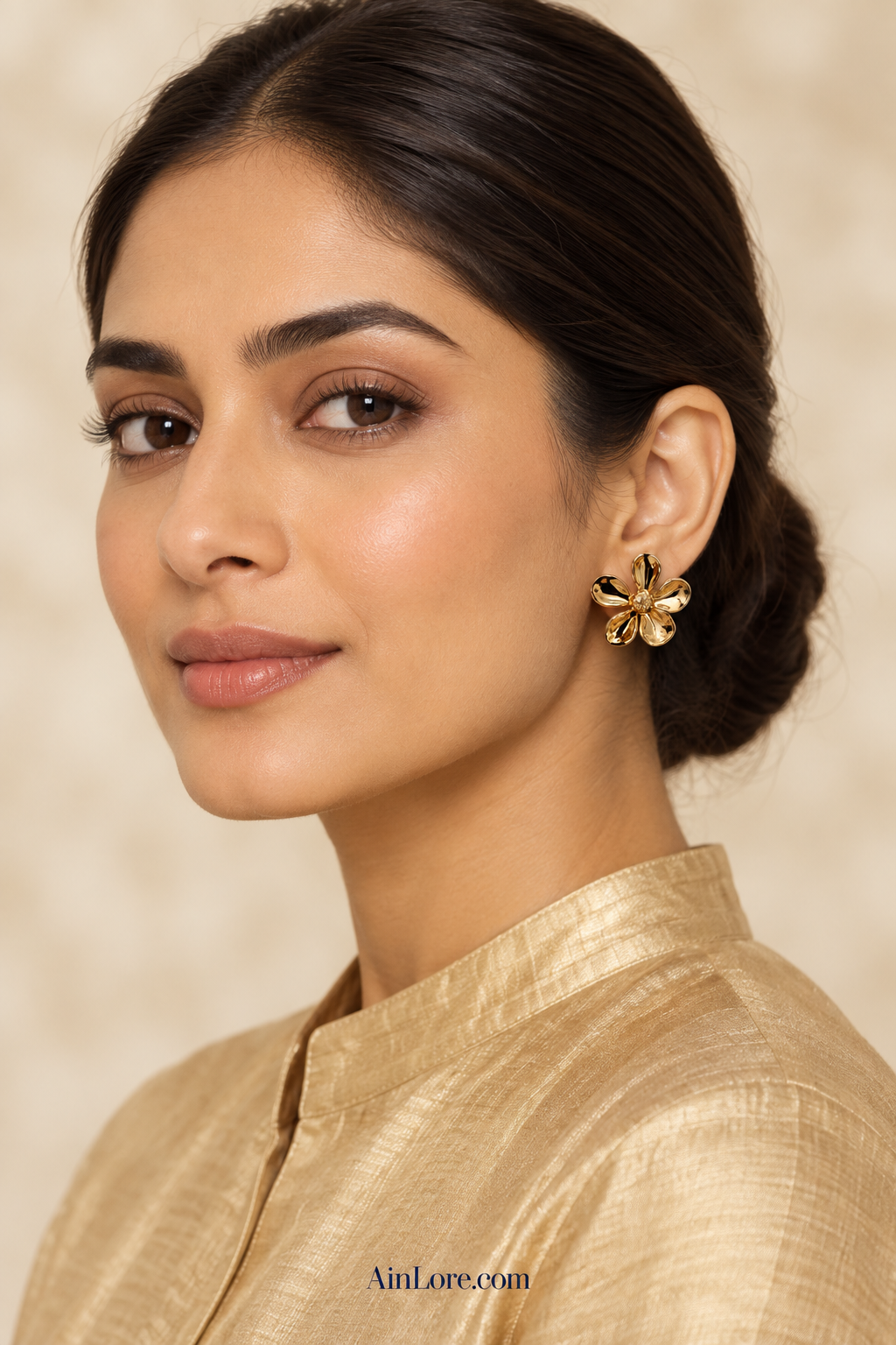 Ananya wearing the gold flower studs in a champagne-gold high-neck kurta