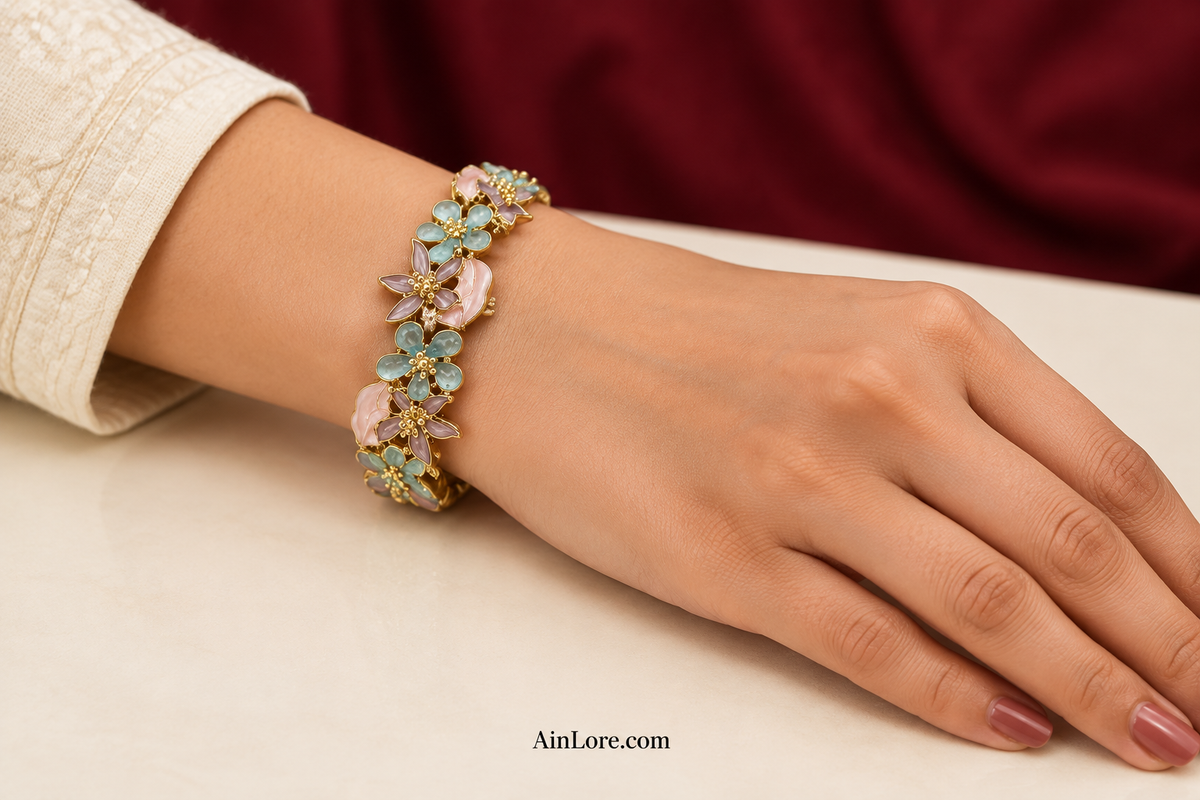 Blue-and-pink bracelet tabletop hand shot