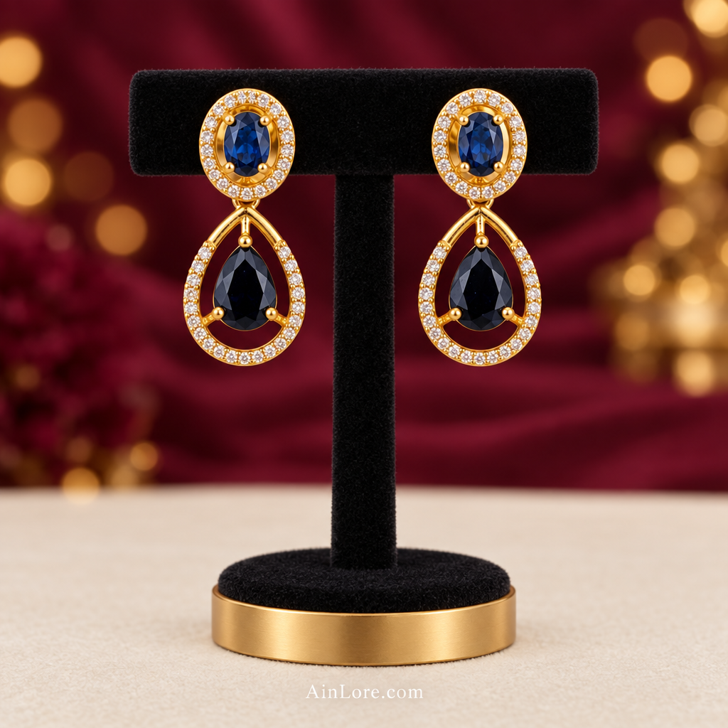 Blue-stone earring pair on a black velvet T-stand