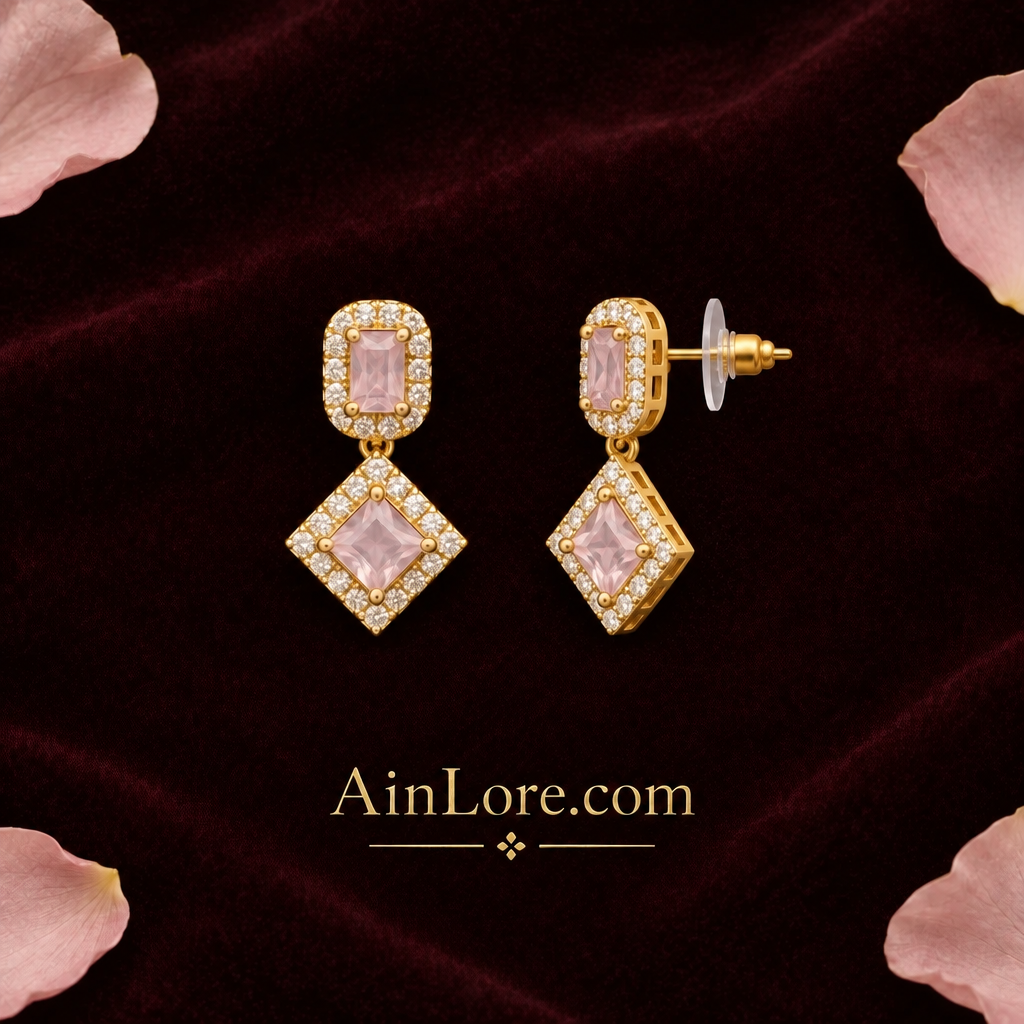 Blush-pink earrings with one tilted to show the clasp
