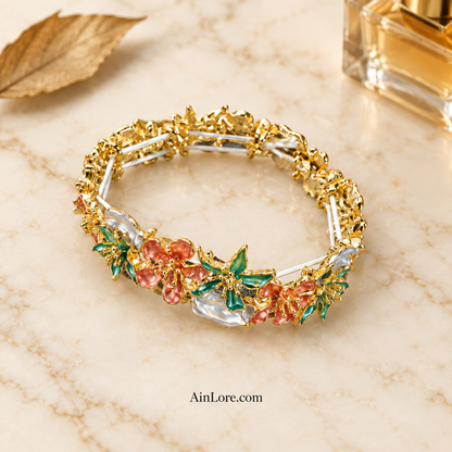 Bracelet on marble with dried leaf and perfume props