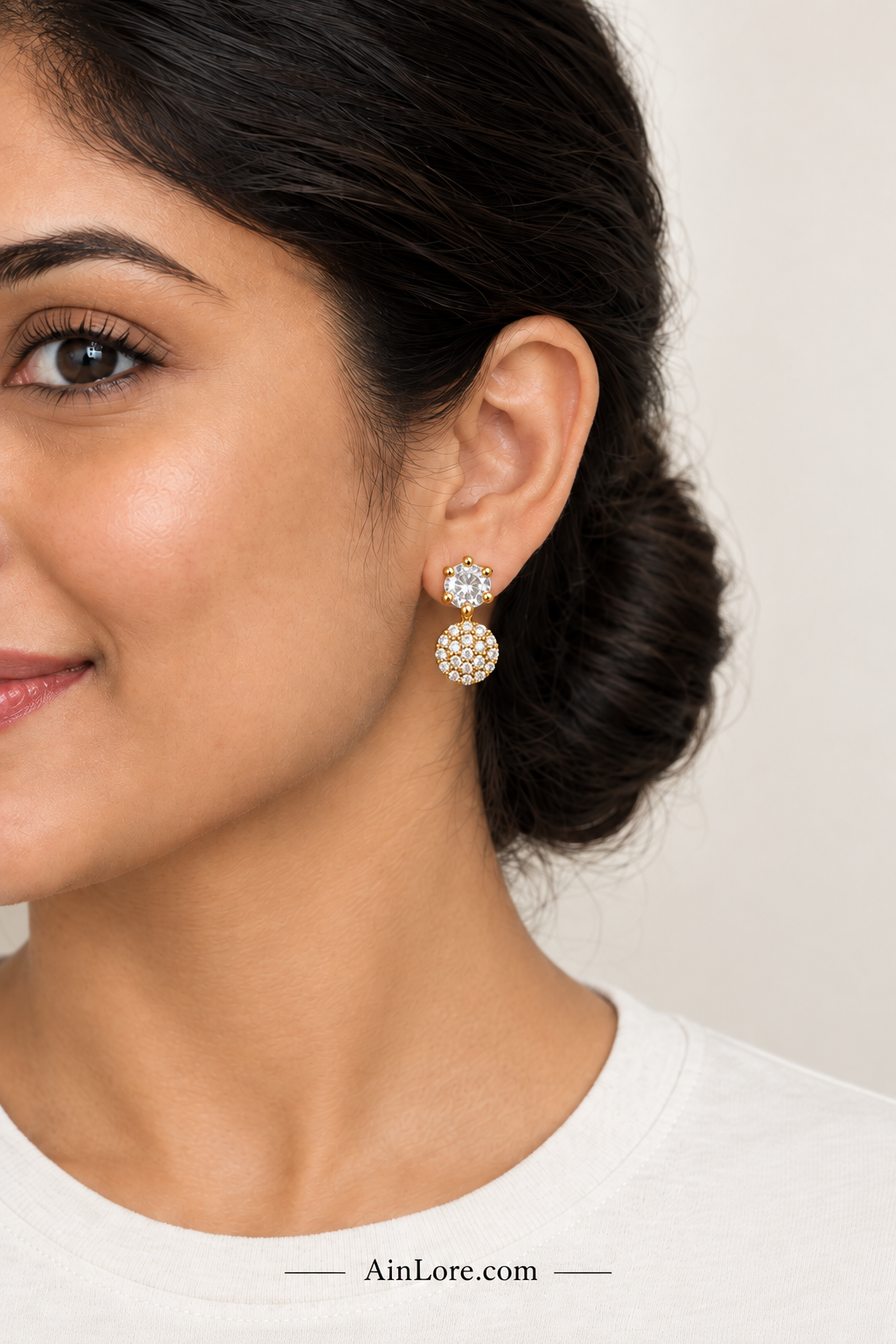 Clear-stone earrings on model
