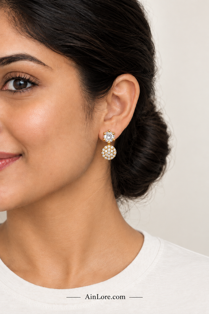 Clear-stone earrings on model