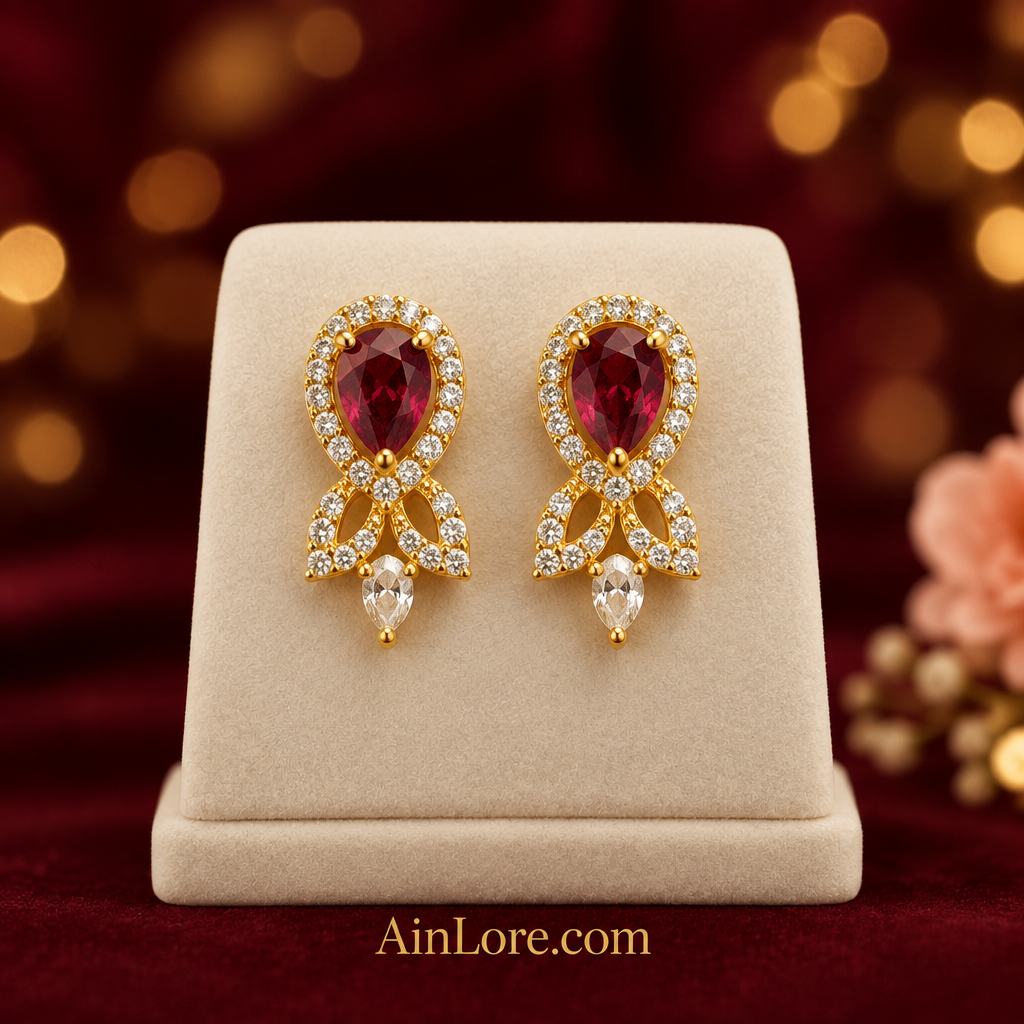 Deep red earrings on display