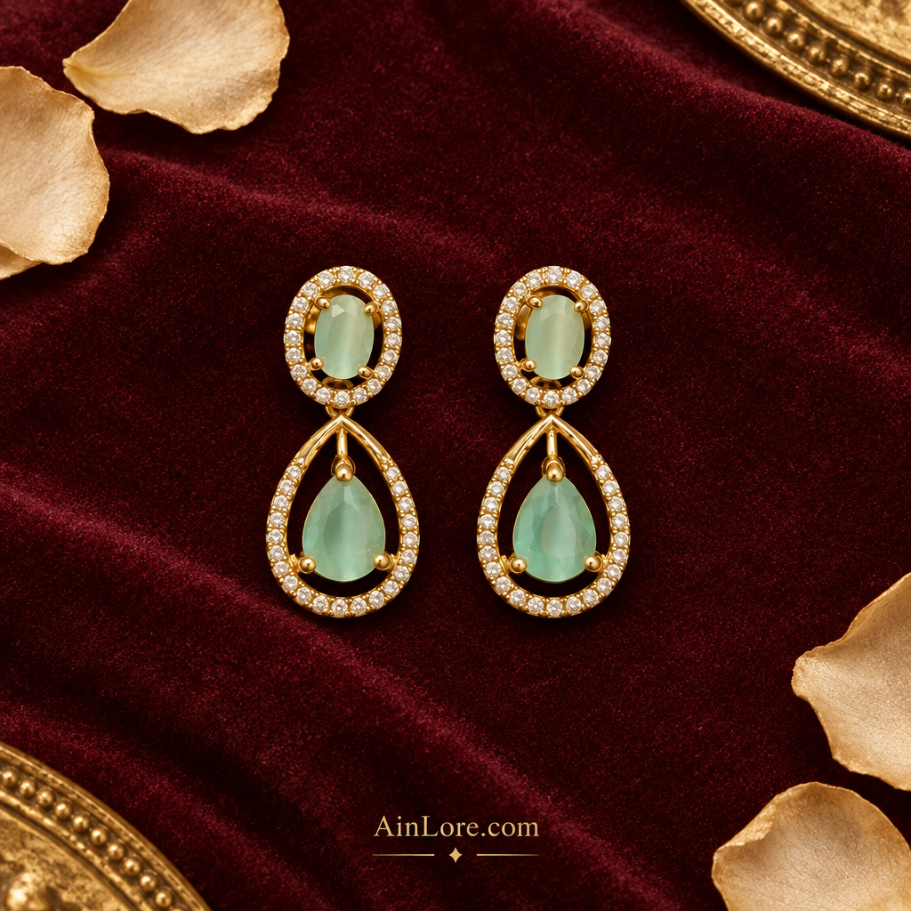 Flatlay of mint green teardrop earrings