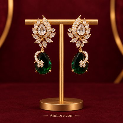 Green-drop earrings on a luxury stand