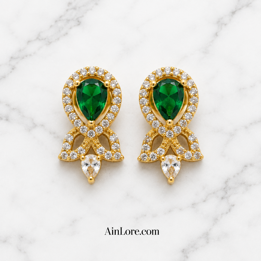 Green earrings on marble