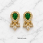 Green earrings on marble