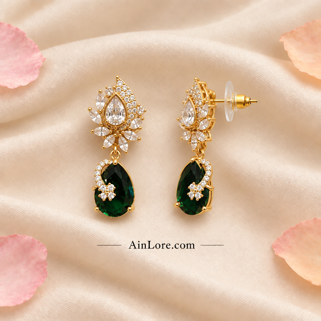 Green earrings with one tilted to show the clasp