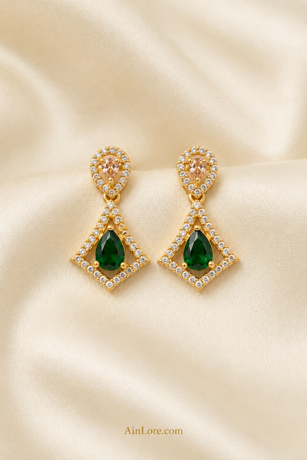 Green kite-drop earrings on cream ribbed fabric
