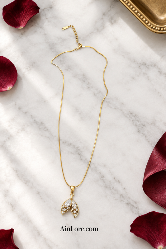 Leaf pendant necklace on marble