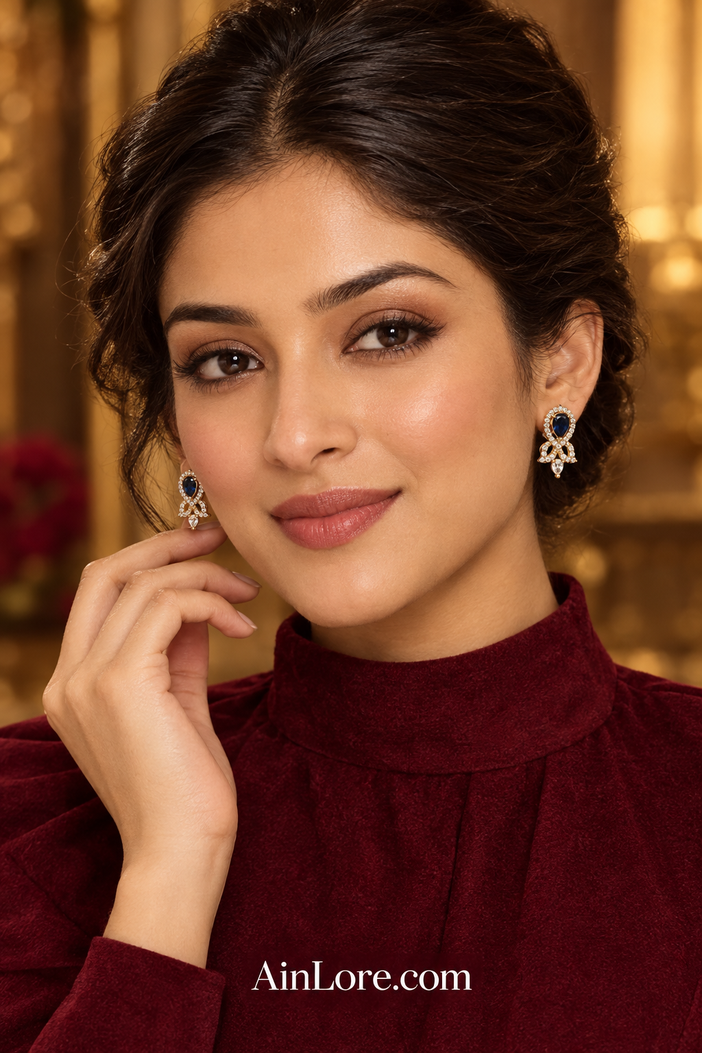 Meena wearing blue earrings