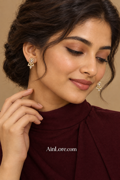 Meena wearing clear-stone earrings