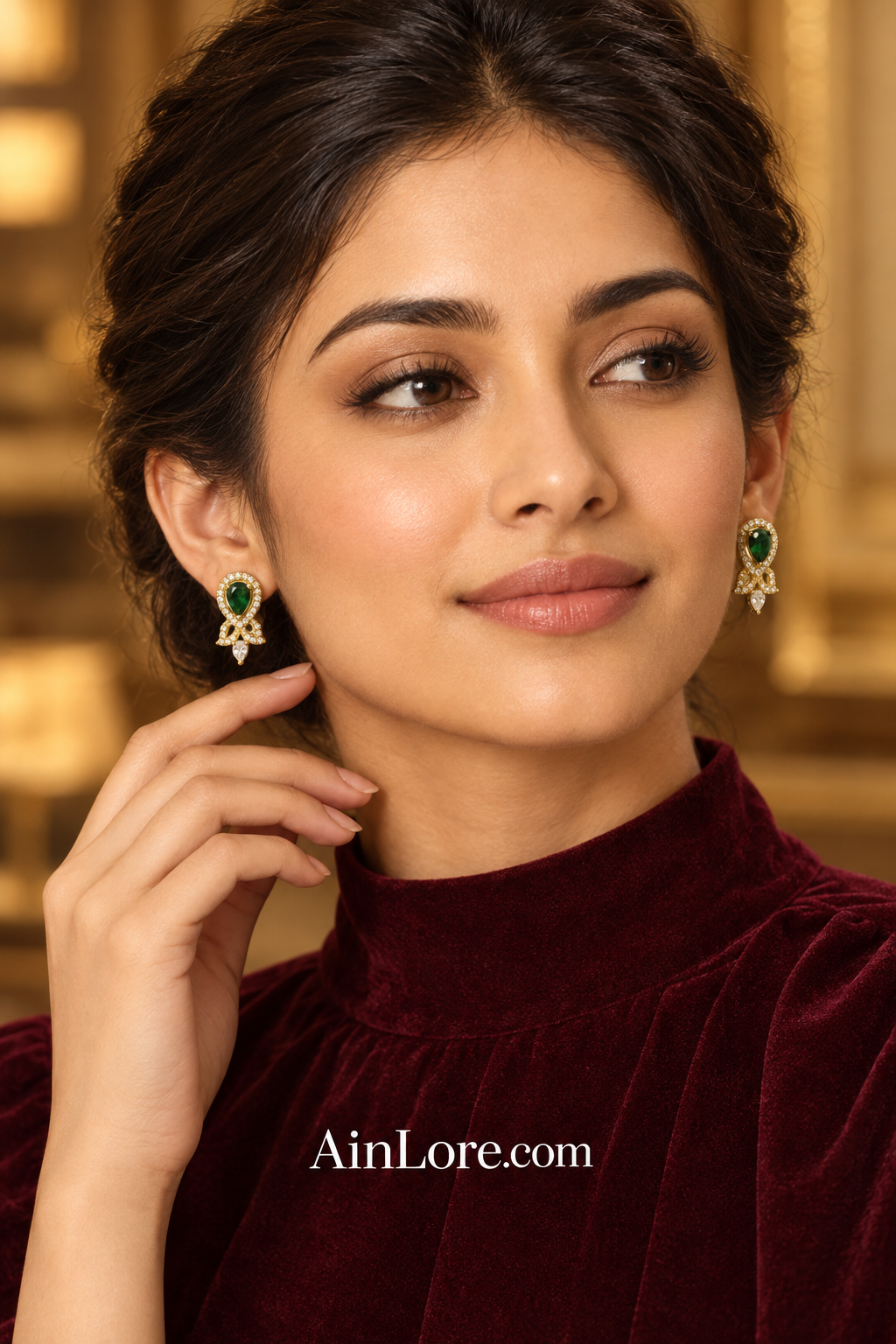 Meena wearing green earrings
