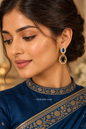 Meena wearing the blue-stone teardrop earring