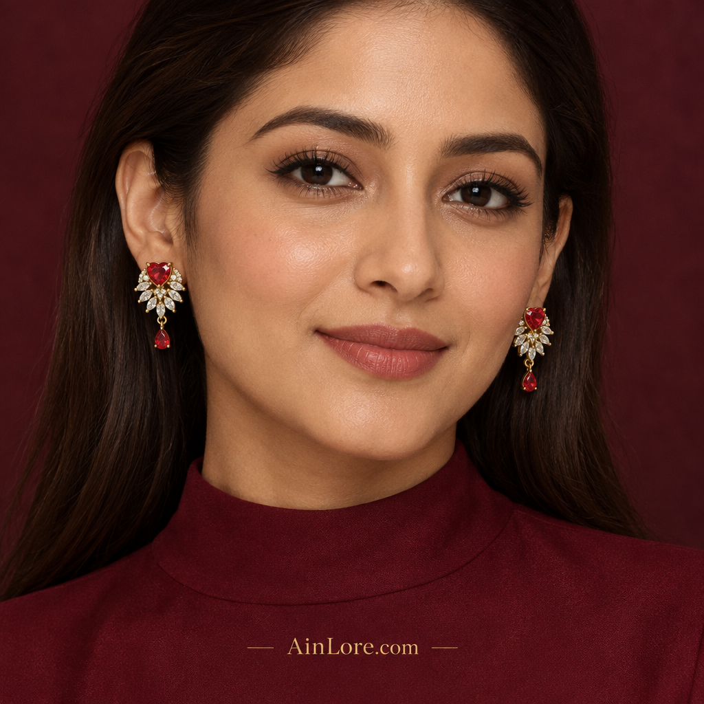 Model wearing red heart drop earrings with a burgundy outfit, AI-styled image