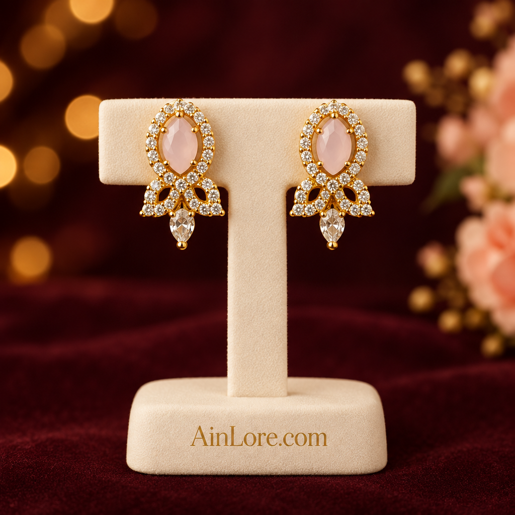 Pale pink earrings on display