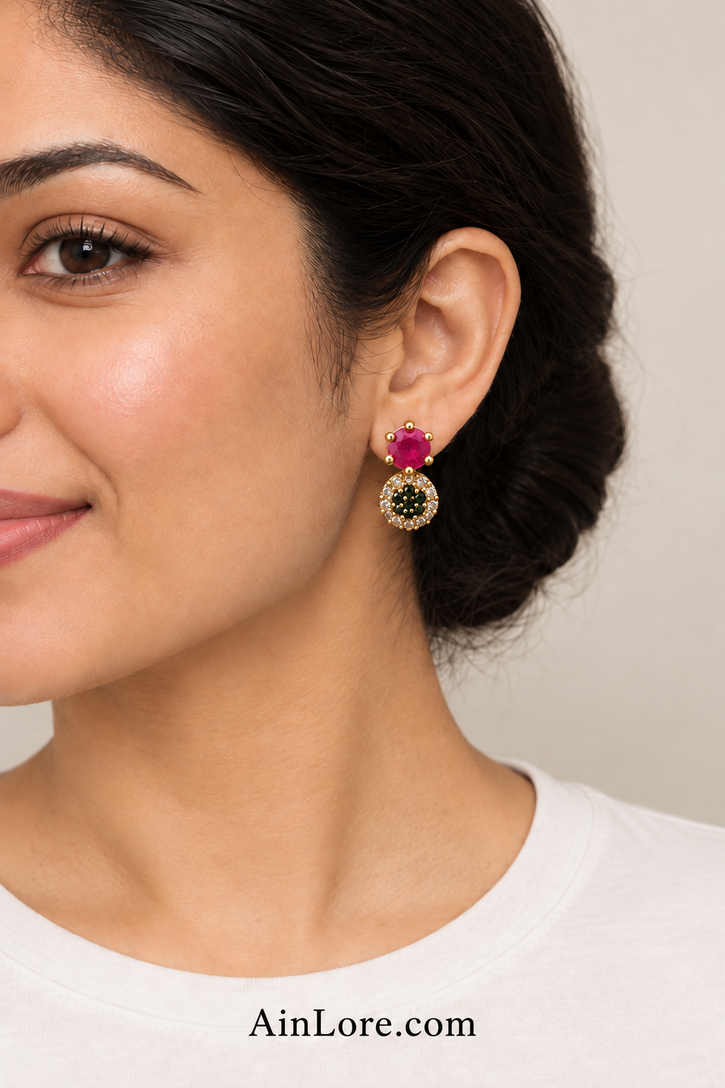 Pink-and-dark-stone earrings on model