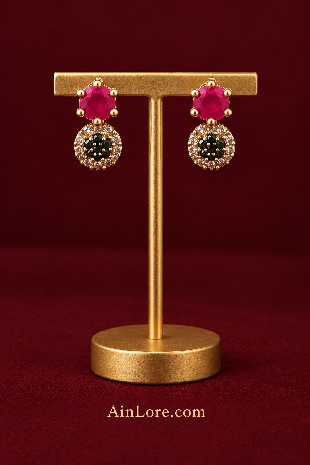Pink-and-dark-stone earrings on stand