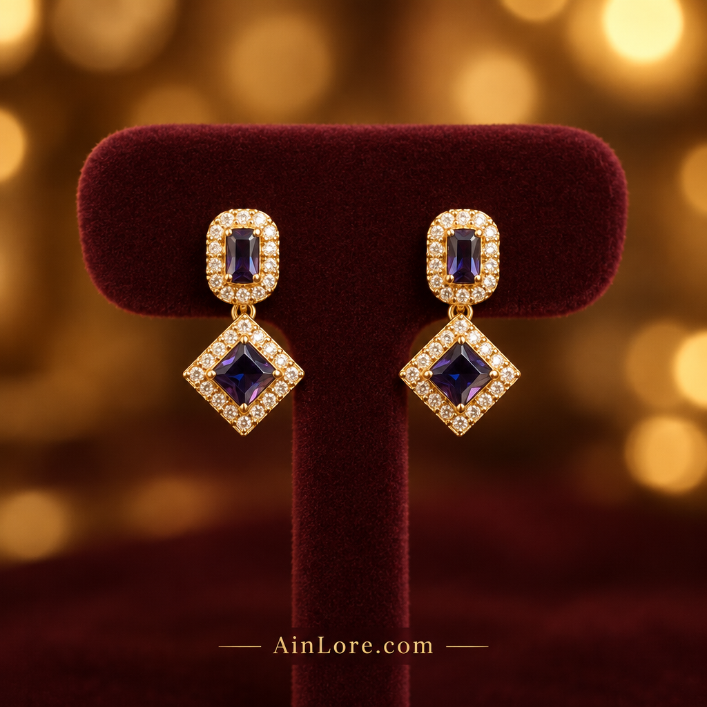 Purple earrings on a display stand
