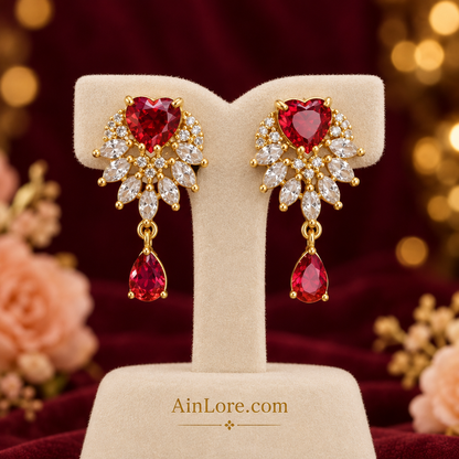 Red heart and teardrop earrings on cream stand against burgundy backdrop, AI-styled image