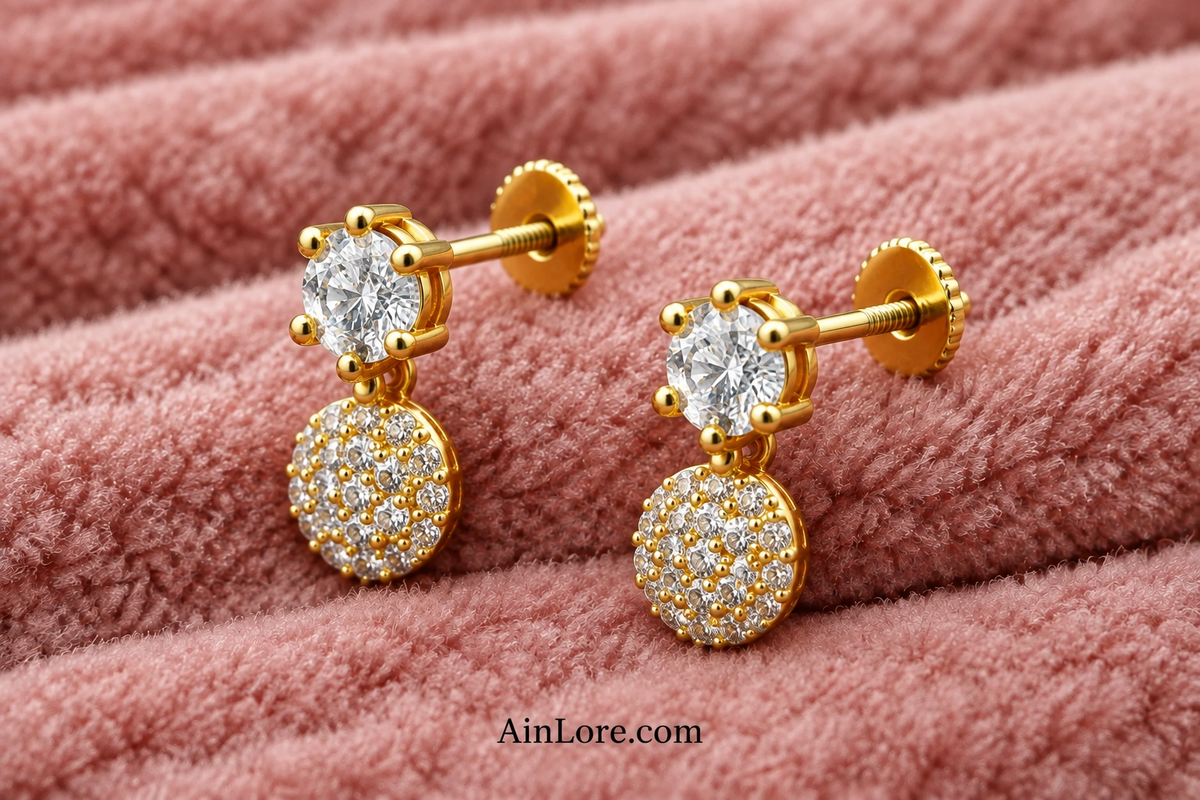 White-stone earrings in tilted flatlay